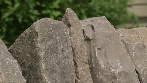 Close up ofcrest then tilt down to deatils of dry stone wall Stock Footage 72568424