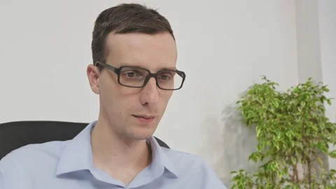 Close-up of the office employee in glasses at work. Video stock 146790329