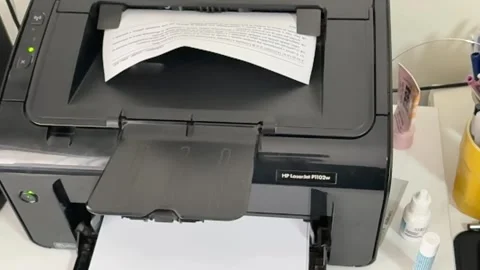 Close-up, office equipment, electrical printer, blank paper pages Stock Footage 303560192