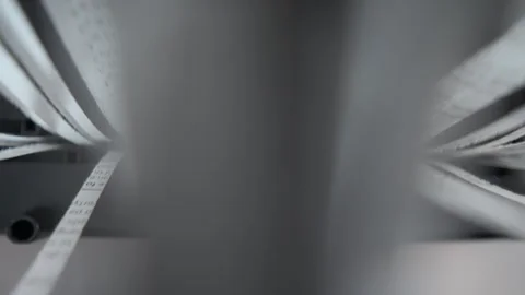 Close up of an office shredder tearing paper into thin, uniform pieces. Stock Footage 304366367