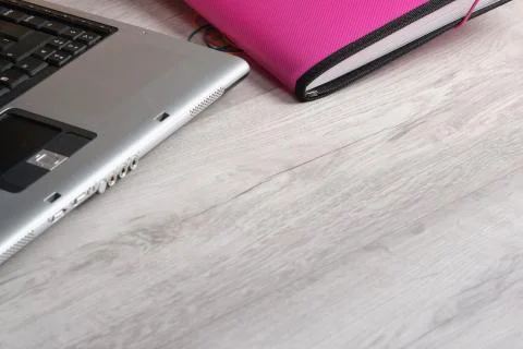Close-up of office supplies with computer, on gray wooden table Stock Photos