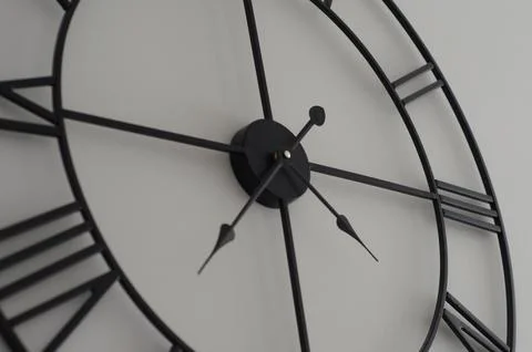 Close up office wall white clock with black arrows Stock-Fotos