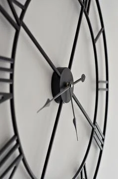 Close up office wall white clock with black arrows Stock Photos