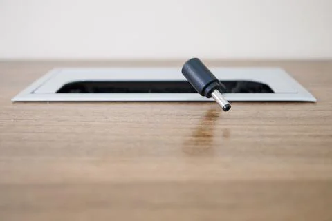 Close up, office work desk that has a cable hole Stock Photos