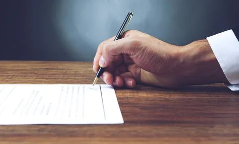 Close up of office worker filling documents Stock Photos
