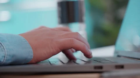 Close up of office worker hands working and typing on a laptop at desk, Stock Footage 327359251