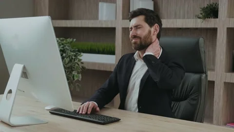 Close up of an office worker holding sore neck while using notebook computer Stock Footage 171470461