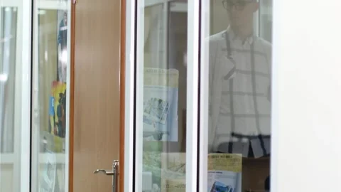 Close-up of an office worker turning the doorknob. Stock Footage 144945733