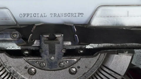 Close up OFFICIAL TRANSCRIPT being typed on vintage typewriter Stock Footage 185103564