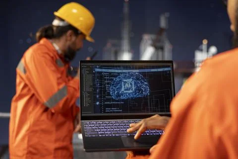 Close up of offshore platform technician using predictive AI models Stock Photos