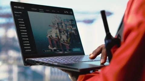Close up of offshore platform worker using AI on laptop Stock Footage 319972150