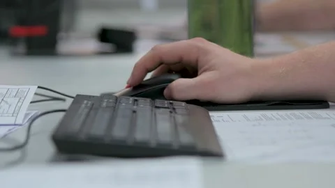 Close up ogf hands typing and clicking on black keyboard and mouse Stock Footage 252076906