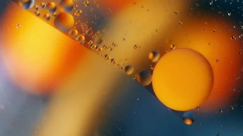Close-up of oil bubbles, background footage, for advertising Stock Footage 138460414
