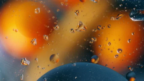 Close-up oil, movement of multicolored bubbles Stock Footage 138460286