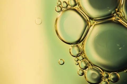 Close up oily bubbles droplets colourful watery backdrop Stock Photos