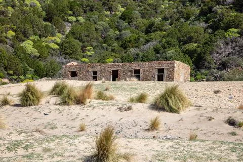 Close up on old abandoned building, without windows and doors, ruins on the.. Foto stock