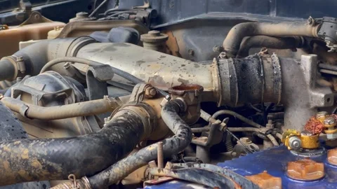 Close up of old and dirty truck engine leaking coolant Stock Footage 300317430