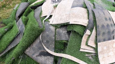 Close Up Of Old Artificial Green Turf Removed For Replacement Foto stock