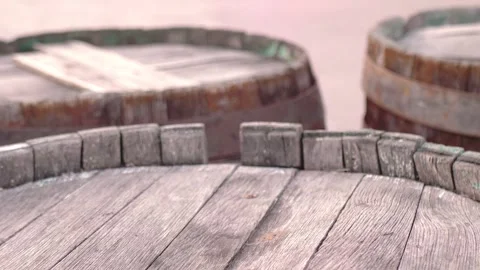 Close-up of old barrels with rusty rims standing on the street. Bondar Stock Footage 258030159