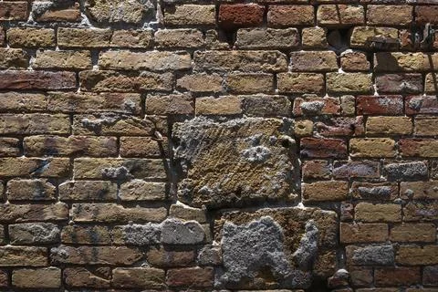 Close-up of an old brick wall with different colors and scuffs, Palermo, Sicily, Stock Photos