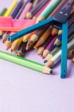 Close-up of old broken compass on old colored pens Stock Photos
