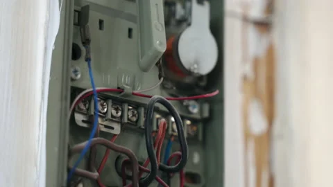 Close-up of old broken intercom, dusted wires and handset, vintage security Stock Footage 135743443