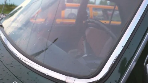 Close up old car in the rain. 4K UHD video. Stock Footage 77624829