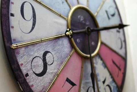 Close up of an old clock with moving pointers Stock Photos