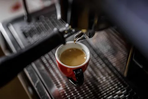 Close-up of old coffee machine with scratches in a bar Stock Photos