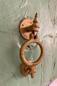 Close-up of an old copper door knocker Stock Photos
