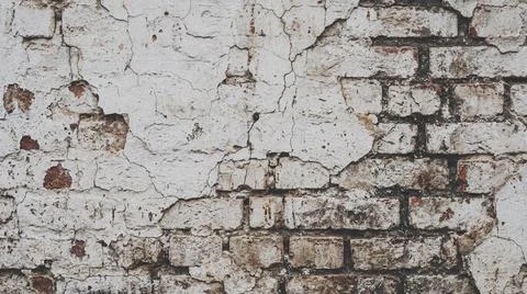 Close-up of old damaged brick wall. Fotos Stock