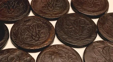 Close-up of old dark brown 5 kopeck coins Elizabeth Petrovna 1758-1762 spre.. Stock Photos
