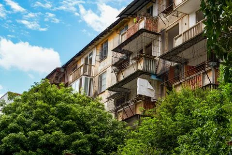 Close-up of old decrepit trees and wooden stakes in an old residential area Stock Photos