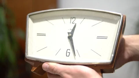 Close-up of an old Desk clock , hands spinning and time goes by . Wooden clock Stock Footage 98951622