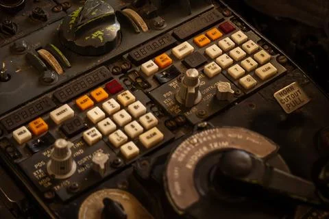 Close-up of an old, dusty, and complex control panel with many buttons and .. Stock Photos