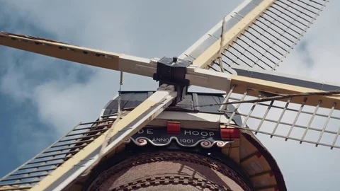 Close up of the old Dutch pumping windmill "de Hoop" while the sails turn Stock Footage 85215377