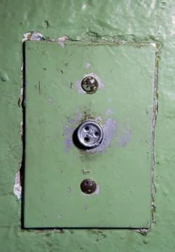 Close-up of old elevator button. Ancient soviet button on concrete wall with Foto stock
