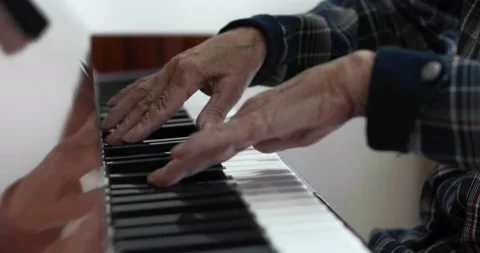 Close-up of old female hands with deep wrinkles playing the piano. Stock Footage 143965279