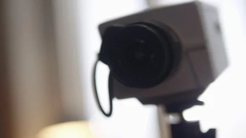 Close-up of old grey square security camera with small black lens. Stock Footage 94978420