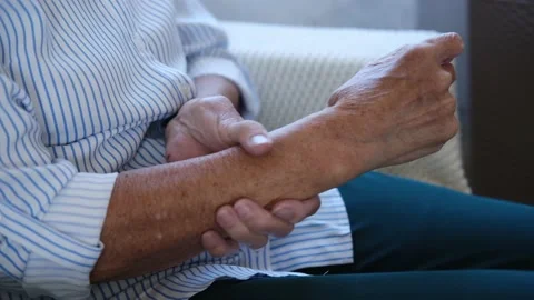 Close up of old hands senior woman massaging from joint pain and feeling hurt Stock Footage 159371153