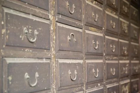 Close up of an old iron locker with small drawers Stock Photos