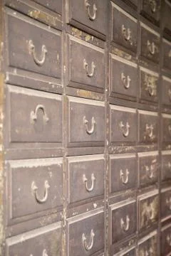 Close up of an old iron locker with small drawers Stock Photos