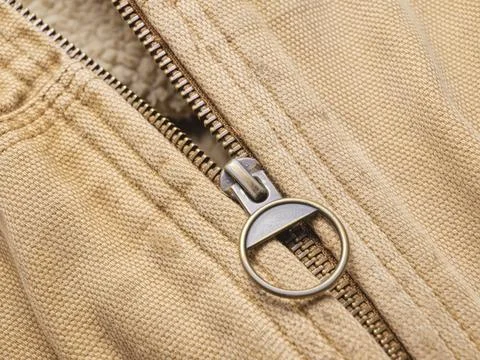 Close up of old jacket and zipper. Stock Photos