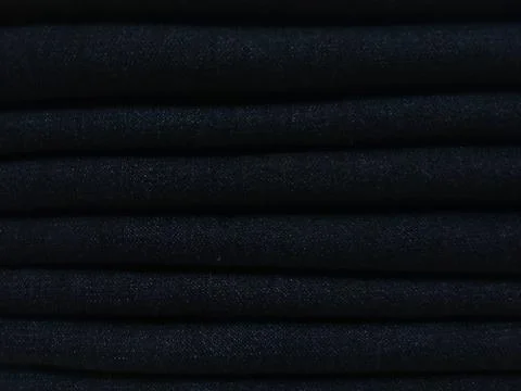 Close-up old Jeans trousers stack background texture. Foto stock