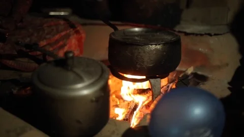 A close up on an old kettle, saucepan placed above fire. Nepalese village. Stock Footage 125809245