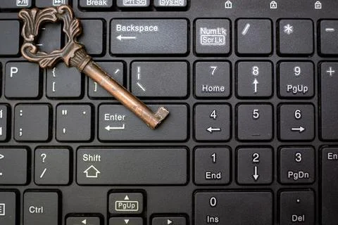 Close up old key and push-button the computer keyboard Foto stock