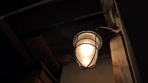 Close-up of an old lamp in a basement or attic Stock Footage 221349106