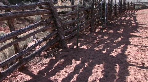 Close-up of an old log fence around an old western corral Stock Footage