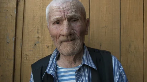 Close-up of an old man with deep wrinkles Stock Footage 143782541