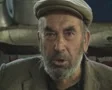 Close up of old man eating in market SD Footage